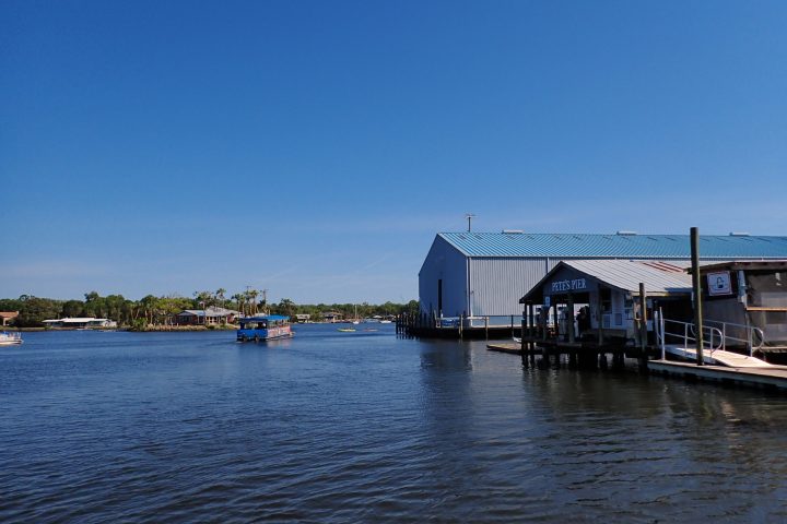 a boat is docked next to a body of water