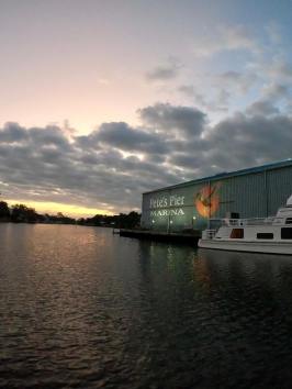 a boat traveling across a bridge over a body of water