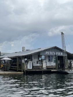 a boat is docked next to a body of water
