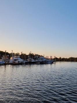 a boat is docked next to a body of water