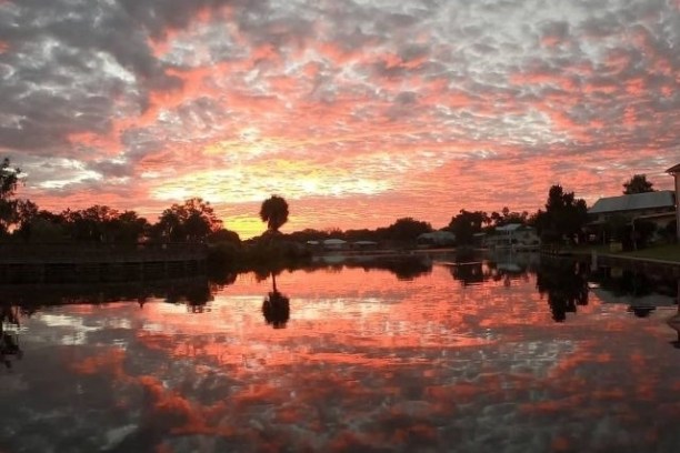 a sunset over a body of water